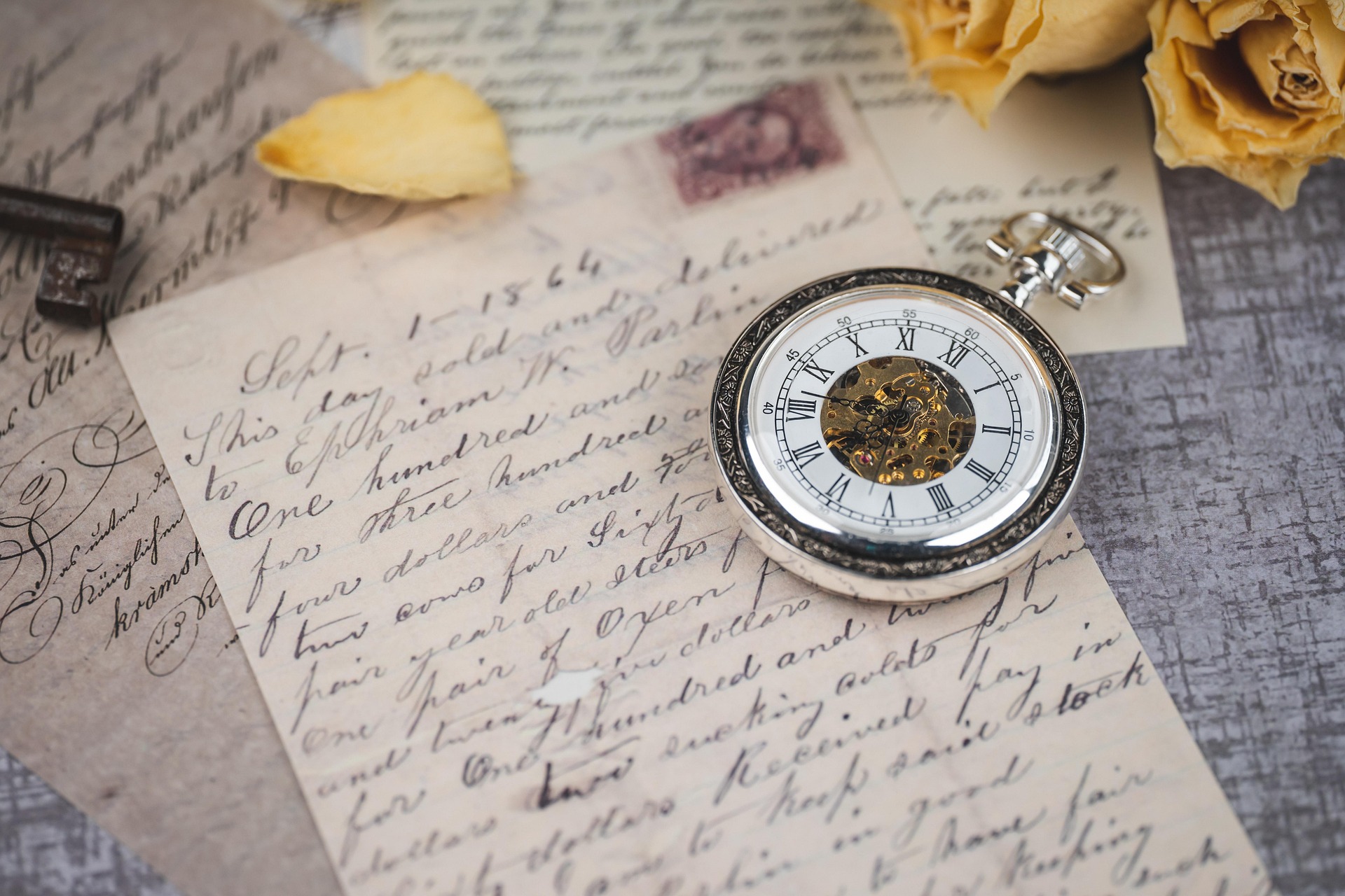 Pocket watch on handwritten paper